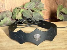 It is a fine leather circlet, with a metal compass mounted on it. The leather band is embossed with classic Celtic knot. And is held in place by lace at the back running through holes with metal. ADJUSTABLE One size fit all. You can make the leather headband adjustments to fit your head size with the lace rope. PERFECT FOR RENAISSSANCE FAIRS for Viking Warrior, suitable for the LARP, Fantasy Events, Comic Con, Halloween Cosplay Parties. This item it will send on First class mail (2 to 5 business Ren Fair Men, Leather Circlet, Warrior Crown, Medieval Headpiece, Leather Headband, Ren Fair, Leather Headbands, Viking Warrior, Mens Costumes