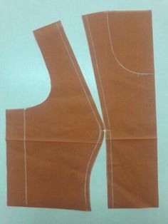 two pieces of brown fabric with white stitching on them, one piece is cut in half