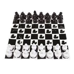 a chess board with black and white pieces on it's sides, all in different shapes