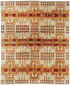 an orange and white rug with geometric designs