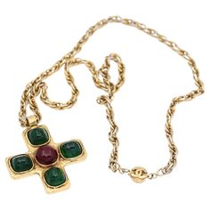 Vintage 1970es CHANEL Gripoix Iconic Cross Pendant. The items is truly massive with Chanel Cross Red and Green Gripoix Glass cabochons. The chain is really long and has a Chanel sign on the lock. It is a real fashion statement that is hard to deny. The iconic Chanel brand needs no introduction. The pendant demands attention and a certain outfit but it will never grow out of style. It is said to be the last collection while Coco was still ruling the business. This cross jewelry line was first sta Chanel Sign, Chanel Ring, Real Fashion, Chanel Brand, Chanel Necklace, Chanel Vintage, Chanel Jewelry, Cross Jewelry, Vintage Chanel