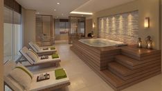 a spa room with large jacuzzi tub and lounge chairs