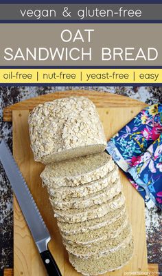 oat sandwich bread on a cutting board next to a knife