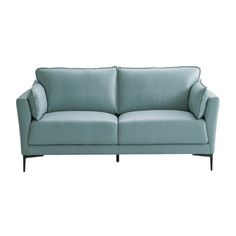 a light blue couch sitting on top of a white floor