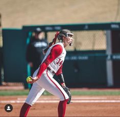 a female baseball player in action on the field