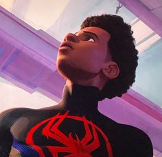 a man in a spider suit looking up into the sky with his eyes closed and hands on his hips