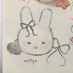 a drawing of a rabbit with a bow on its head and another bunny in the background