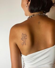 a woman with a tattoo on her back