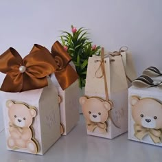 three small boxes with teddy bears on them