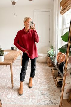 a woman taking a selfie in her living room