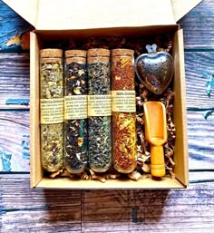 An exquisite tea sampler gift box set with 4 fulfilling sweet invigorating flavors and aromas. Comes complete with a stainless-steel heart-shaped tea infuser, bamboo tea scoop/spoon, and a brown gift box. 2 loose-leaf hand-blended organic herbal caffeine-free tisanes and 2 loose-leaf hand-blended organic herbal caffeinated teas. Packaged in glass tubes with cork lids (sealed for freshness and safety). Made fresh to order with premium high-quality organic, ethically sourced dried herbs, fruits, f Tea Blend Packaging, Apothecary Packaging, Loose Leaf Tea Storage, Tea Bag Packaging, Apple Cinnamon Tea, Gift Box Business, Tea Sampler Gift, Self Creation, Caffeine In Tea