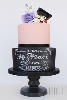 a three tiered cake with writing on it