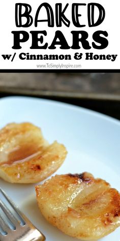 baked pears with cinnamon and honey on a white plate next to a silver fork