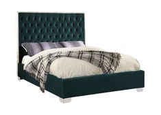 an upholstered bed with green velvet headboard and foot board, made in the uk