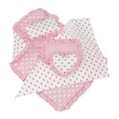 three baby bibs with pink and white polka dots on the bottom, one has a heart shaped bib