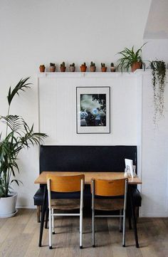 a couple of chairs sitting next to each other on top of a hard wood floor