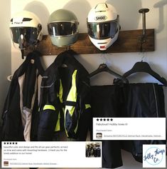 helmets and jackets are hanging on a wall