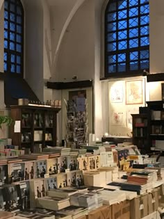 many books are on display in a large room