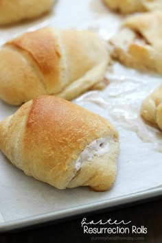 several rolls are on a baking sheet and ready to be baked in the oven or used as an appetizer