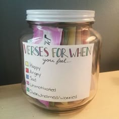 a jar filled with lots of different colored papers