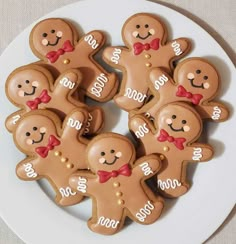 a plate with cookies decorated to look like gingerbreads