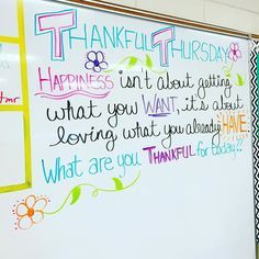 a white board with writing on it in front of a wall that says thank you