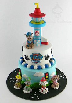 a birthday cake with toy animals on it