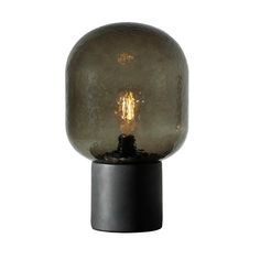 a light that is sitting on top of a black stand with a glass ball in the middle