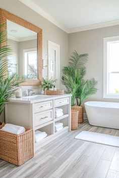 a bathroom with a tub, sink and large mirror in the corner next to two palm trees