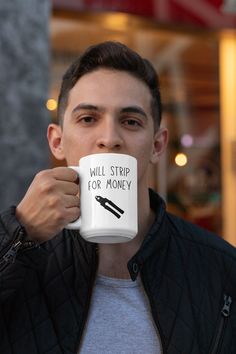 a man holding a coffee mug in his right hand with the words fuel for gamer on it