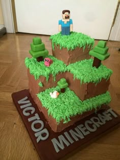 a cake made to look like a minecraft house on top of a wooden floor