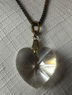 "Choice of two clear heart pendants: A tiny clear crystal heart pendant on a long 30\" chain. A tiny rhinestone outline heart pendant on an 18\" chain. Also, please take a look at my storefront at: https://www.etsy.com/shop/FabFinds42?ref=seller-platform-mcnav I have a wide selection of one-of-a-kind items, from clothing and toys to home decor and gift items, and I add new things almost every day!" Silver Crystal Heart Pendant Necklace, Clear Heart Charm Necklace, Clear Heart Charm Necklace With Heart Pendant, Clear Heart Necklace, Valentine's Day Silver Heart Pendant Crystal Necklace, Silver Heart-shaped Crystal Necklace With Heart Charm, Heart-shaped Sterling Silver Crystal Necklace As Gift, Clear Glass Heart Pendant Necklace, Clear Heart