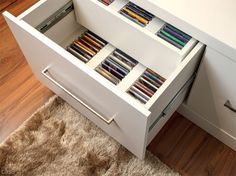 the drawers are full of books and crayons