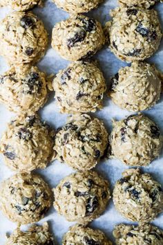 cookies and oatmeal are arranged on a sheet of parchment paper, ready to be eaten