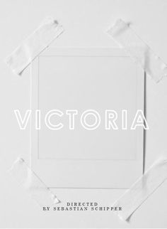 the word victoria is placed in front of a white background with torn pieces of paper