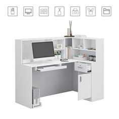 an office desk with a computer monitor and keyboard on it's left side, next to a white filing cabinet