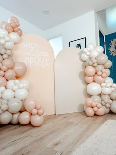 there are balloons that spell out the word love in front of an arch and door