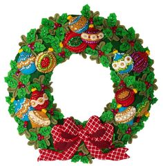 a christmas wreath with an owl and other decorations