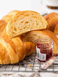 croissants on a cooling rack with jam