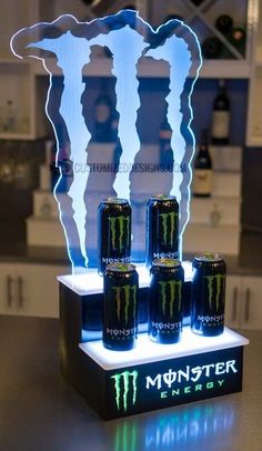 the monster energy drink display is lit up and ready to be used as a decoration