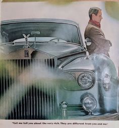 an old car advertisement with a man standing on it's hood and looking at the front