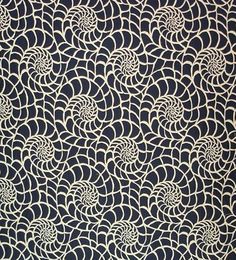 an intricate black and white wallpaper with swirls on the back ground, in front of a dark blue background