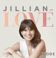 a smiling woman with her arms crossed in front of the cover of julian love magazine