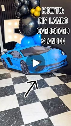 a blue car with balloons on top and the words how to diy lambo cardboard standee