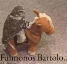 an owl sitting on top of a stuffed horse with the caption fumos bartolo