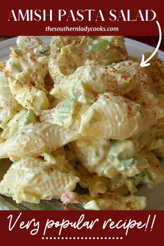 a white plate topped with pasta salad next to a red and white sign that reads, one of our most popular recipes