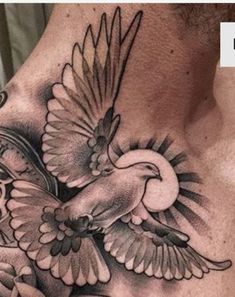 a man's chest with an eagle tattoo on it