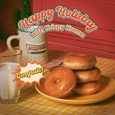 doughnuts on a plate next to a cup of coffee and an advertisement for krispy kreme