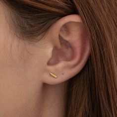 Classic and dainty, the Mini Bar stud earrings are equal parts minimal and feminine. A goes-with-everything design, their shape is made to complement your ear-design lineup. - Gold Vermeil - Coated in 18K gold (2.5 microns) - Sterling Silver Base - Length: 6 mm - Width: 1 mm JEWELRY CARE As with all metals, special care must be taken to ensure they do not scratch or tarnish over time. Follow these simple steps to keep your pieces looking their best:Avoid direct contact when applying cosmetics, p Ear Design, Bar Stud Earrings, Bar Studs, Bar Earrings, Mini Bar, Jewelry Ideas, Jewelry Care, Gold Vermeil, Gold Earrings