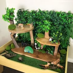 an indoor display with fake animals and plants